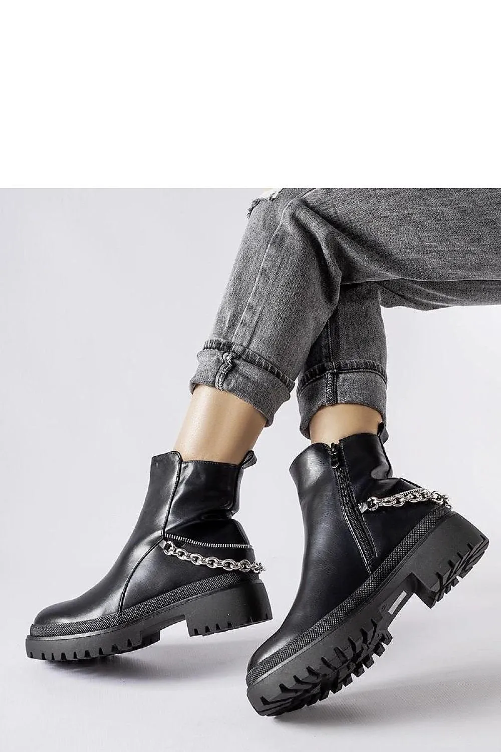 Brown ankle boots with a chain