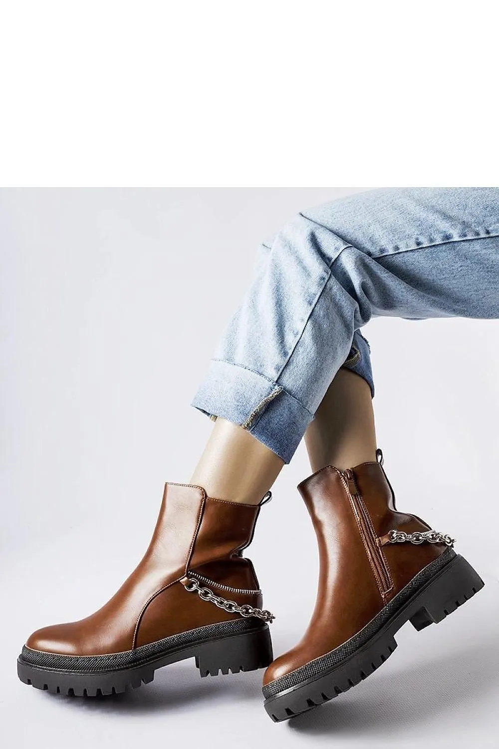 Brown ankle boots with a chain